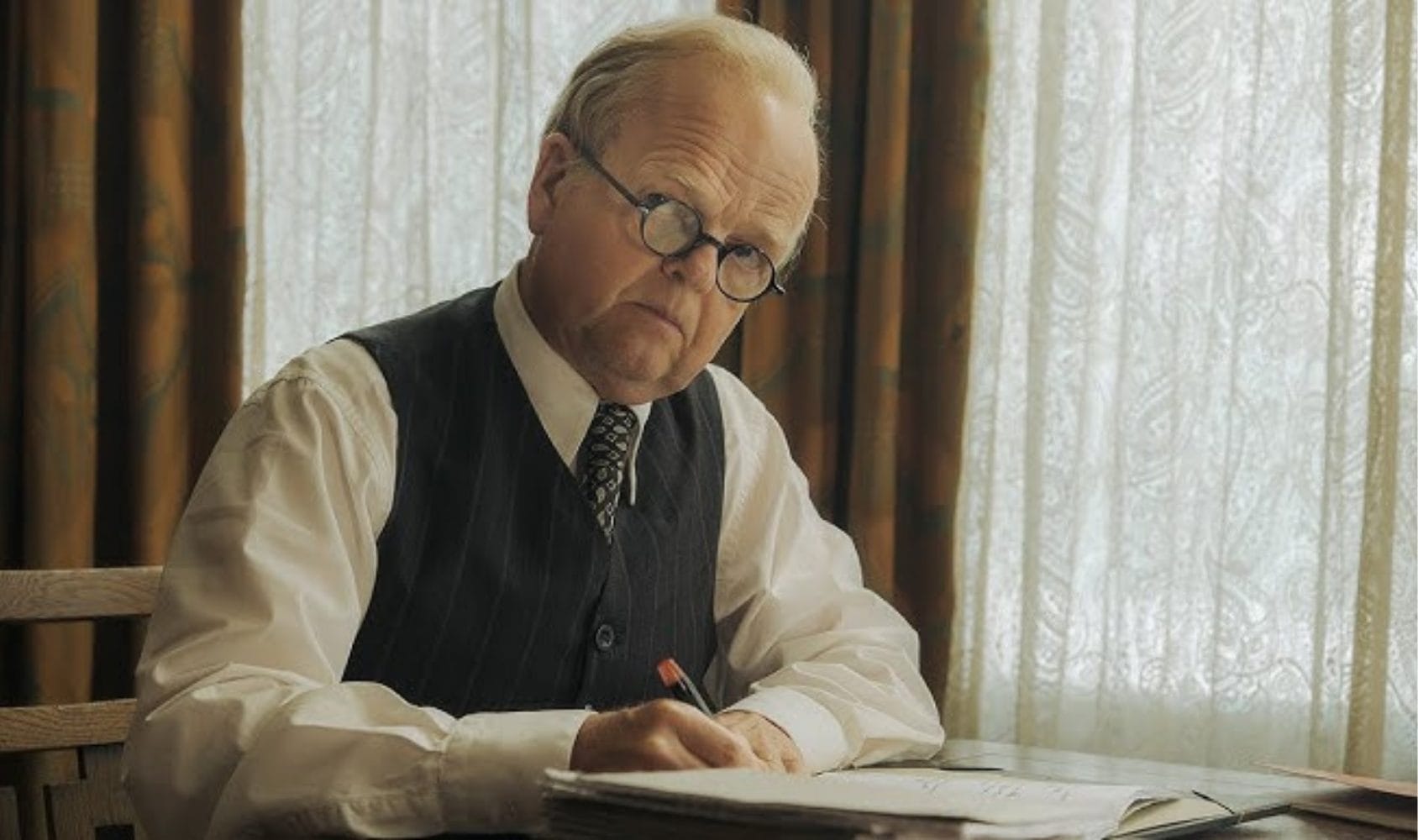 Toby Jones as Philip Burton.