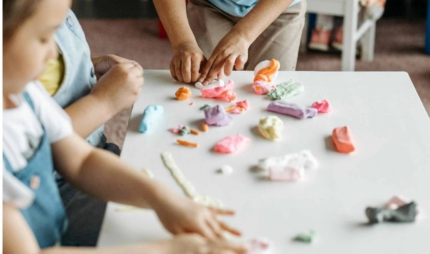 Children playing with play dough.