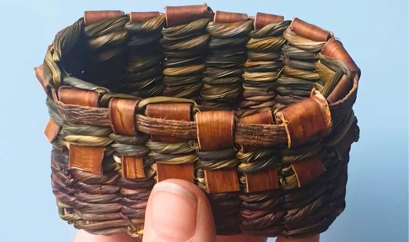 A small basket woven from leaves.